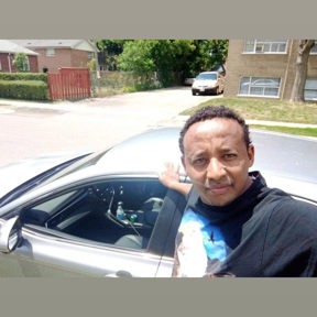 Man standing next to car