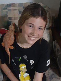 Teen girl with lizard on shoulder